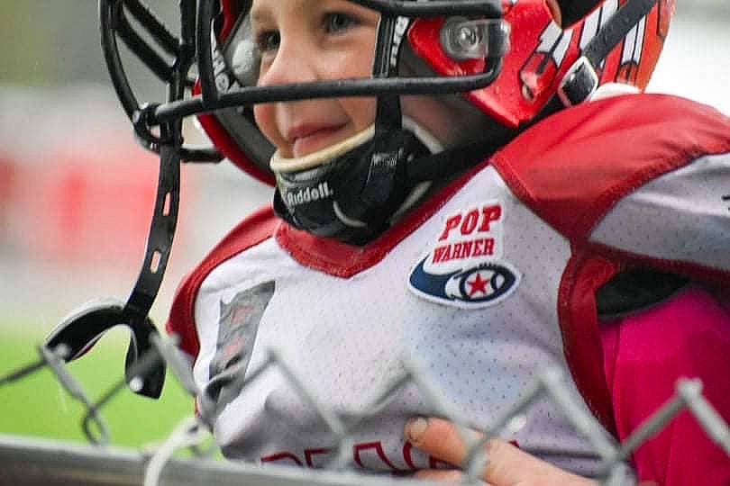 Braxton is registered to the contest to win money with this photo: american_football, ball_game, canadian_football, face_mask, football_equipment, football_gear, football_helmet, headgear, helmet, hockey_protective_equipment, jersey, person, personal_protective_equipment, player, sports, sports_equipment, sports_gear, sports_jersey, sports_uniform, sportswear