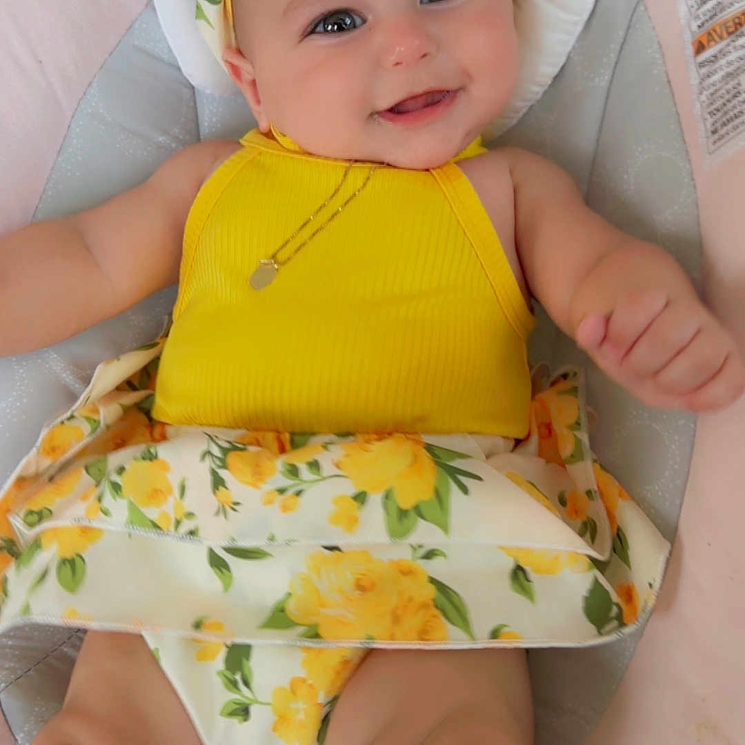 Madelyn is registered to the contest to win money with this photo: accessories, baby, bonnet, cap, clothing, cushion, dress, face, furniture, happy, hat, head, homedecor, jewelry, necklace, newborn, person, photography, portrait, smile