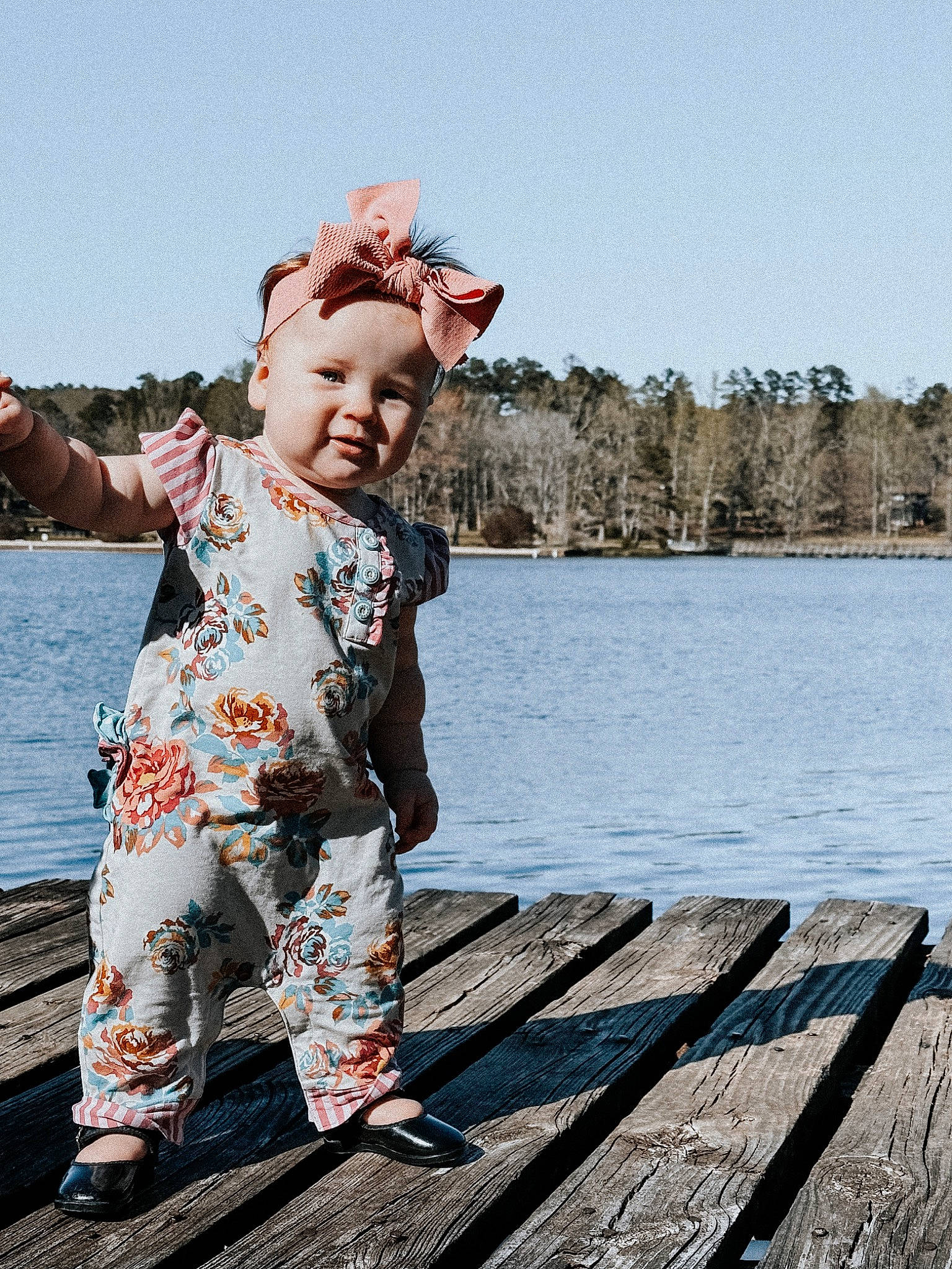Payton is registered to the contest to win money with this photo: baby, child, flash_photography, fun, happy, hat, lake, leisure, pattern, people_in_nature, person, recreation, sitting, sky, sleeve, smile, toddler, travel, tree, water