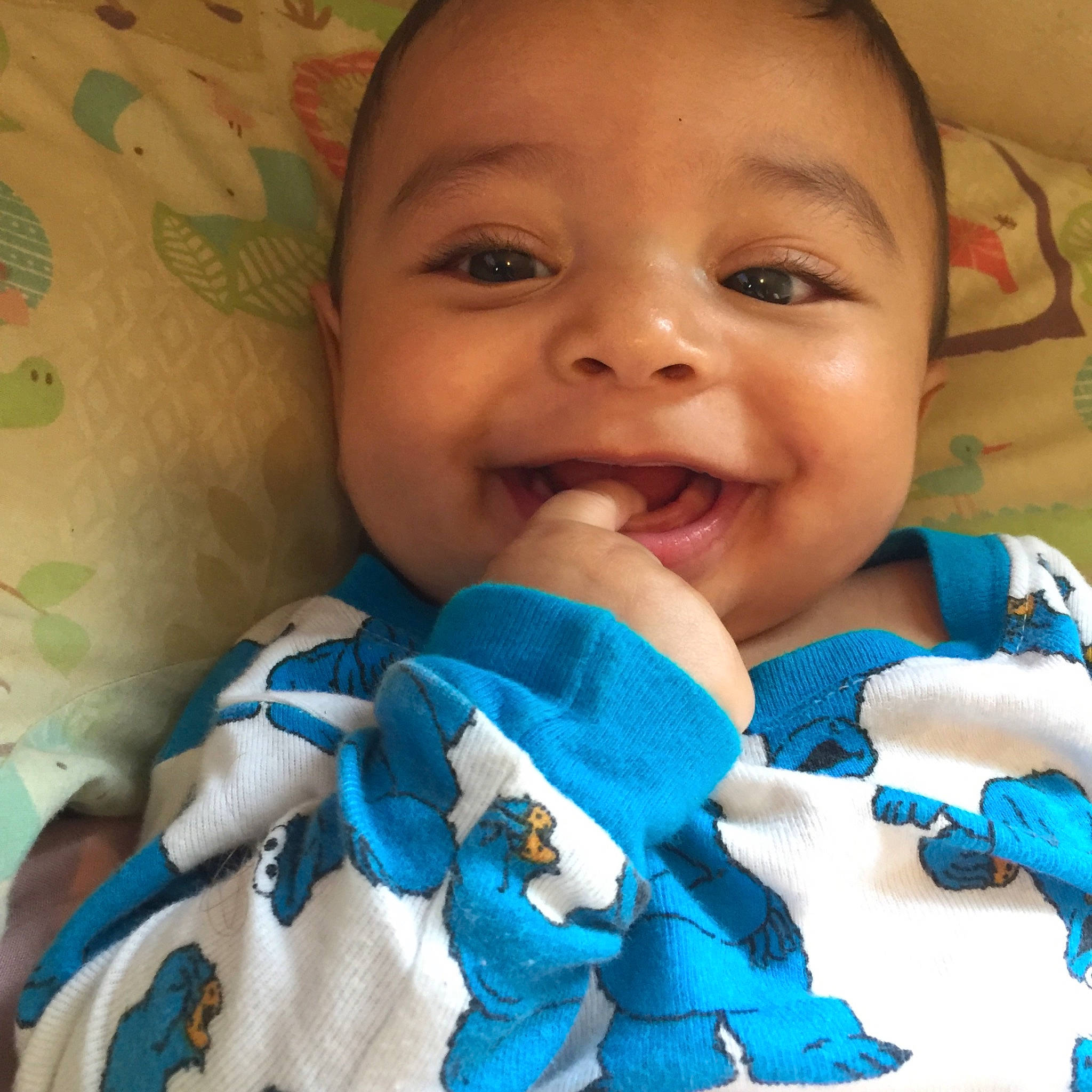 Marcellus is registered to the contest to win money with this photo: baby, baby_toddler_clothing, blue, cheek, cool, electric_blue, eyelash, finger, gesture, happy, iris, joy, lip, mouth, nail, nose, person, skin, smile, textile