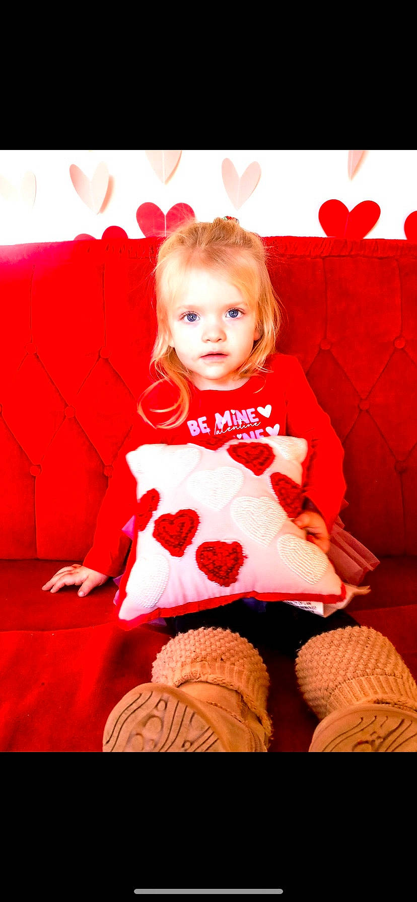 Adaleigh is registered to the contest to win money with this photo: baby_toddler_clothing, blond, child, comfort, fun, happy, head, human_leg, knee, magenta, pattern, person, pink, red, sitting, skin, sleeve, sock, standing, thigh