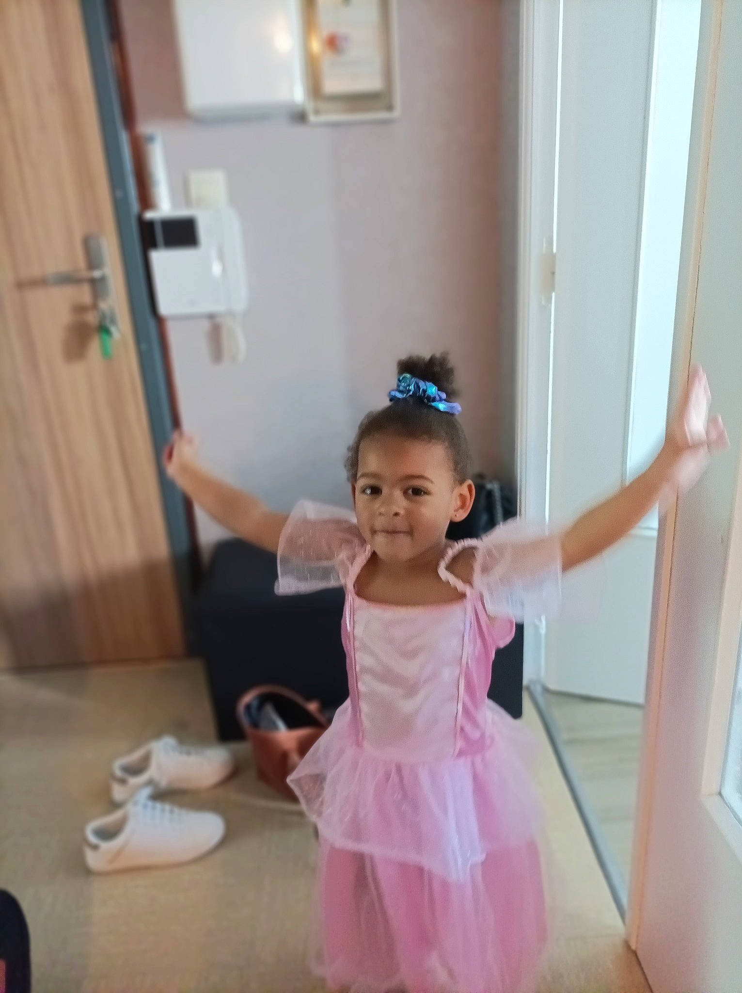 Hillary participe au concours pour gagner de l'argent avec cette photo : baby_toddler_clothing, ballet_tutu, child, dance, door, dress, entertainment, event, floor, flooring, fun, gesture, happy, hardwood, joy, magenta, person, purple, shoulder, standing