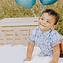 toddler, child, smiling, curly_hair, blue_shirt, sandals, blanket, balloons, wooden_letters, one, outdoor, grass, birthday, celebration, happy, cute, portrait, crawling, baby, sunny