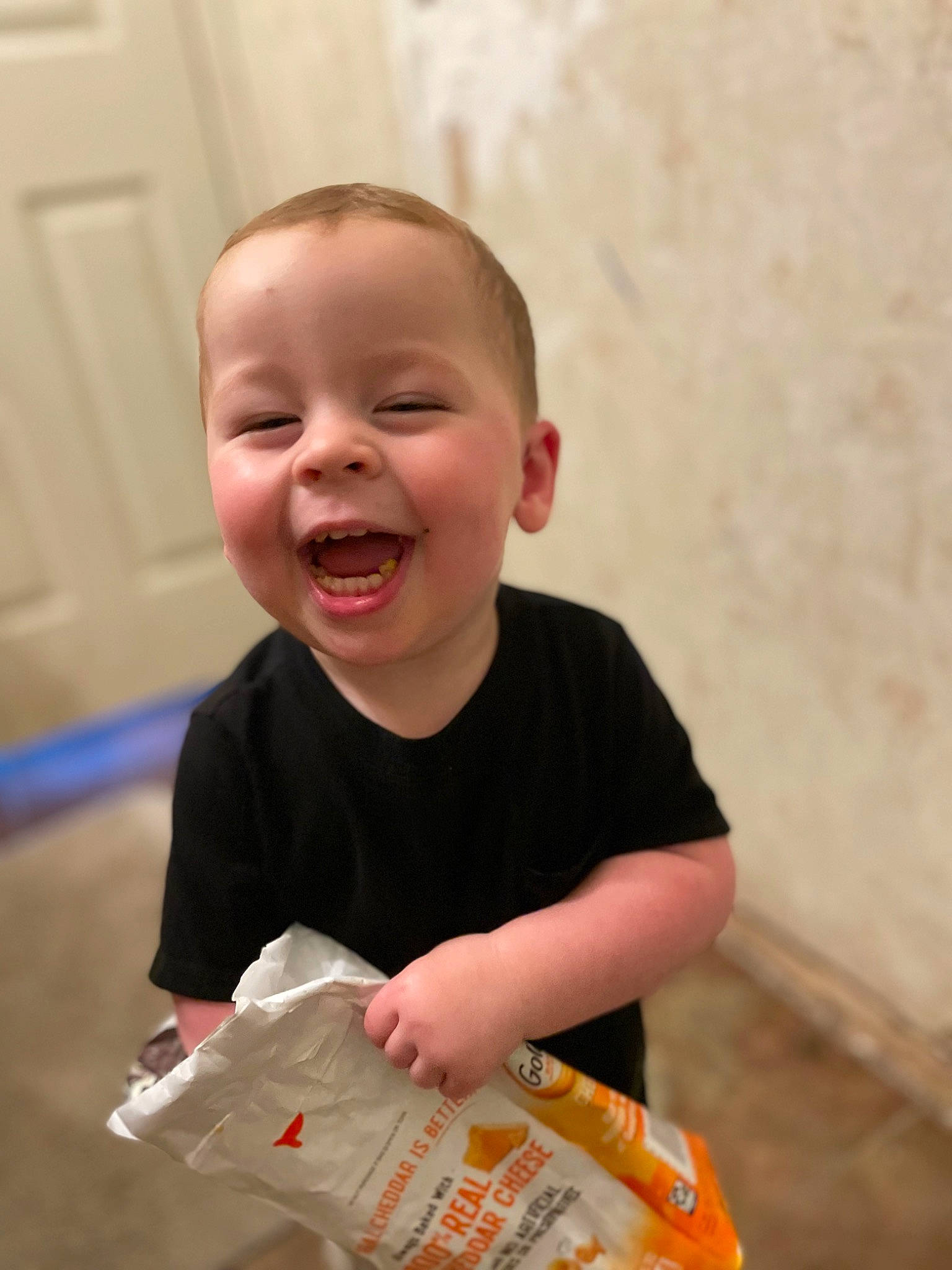 Bentley is registered to the contest to win money with this photo: baby, baby_laughing, baby_toddler_clothing, cheek, child, door, event, eye, facial_expression, fun, happy, laugh, nose, person, play, sitting, skin, sleeve, smile, t_shirt
