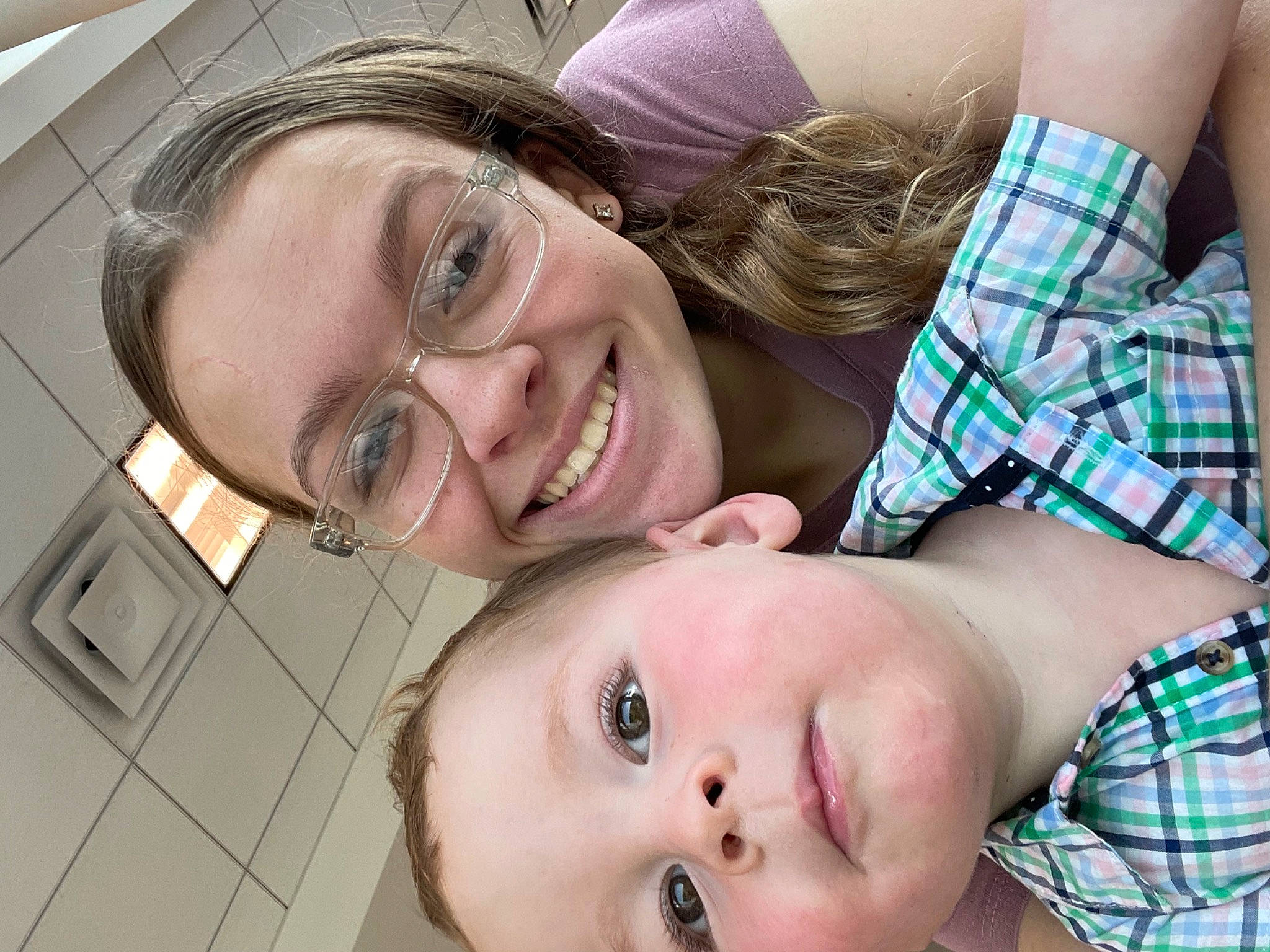 Bentley is registered to the contest to win money with this photo: eyebrow, eyelash, eyewear, face, facial_expression, fun, gesture, glasses, happy, jaw, joy, leisure, mouth, nose, people, person, plaid, skin, smile, tartan