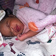 Nevaeh is registered to the contest to win money with this photo: baby, bedtime, blanket, child, closeup, cozy, cute, fabric, face, footprint, hand, infant, newborn, pattern, peaceful, pink, rest, sleeping, soft, toddler