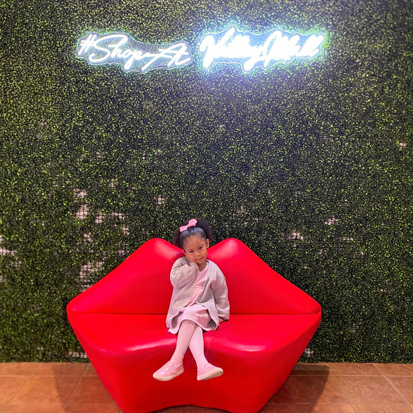 Kiyannah is registered to the contest to win money with this photo: cap, chair, child, clothing, face, female, footwear, furniture, girl, hat, head, indoors, interiordesign, lighting, pants, person, photography, portrait, shoe, sitting