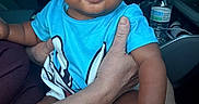 Jayden joined the competition — help win amazing prizes! adult_hand, baby, blue_shirt, candid, car, child, dashboard, daylight, face, family, happy, indoors, infant, portrait, road_trip, sitting, smiling, socks, vehicle, water_bottle