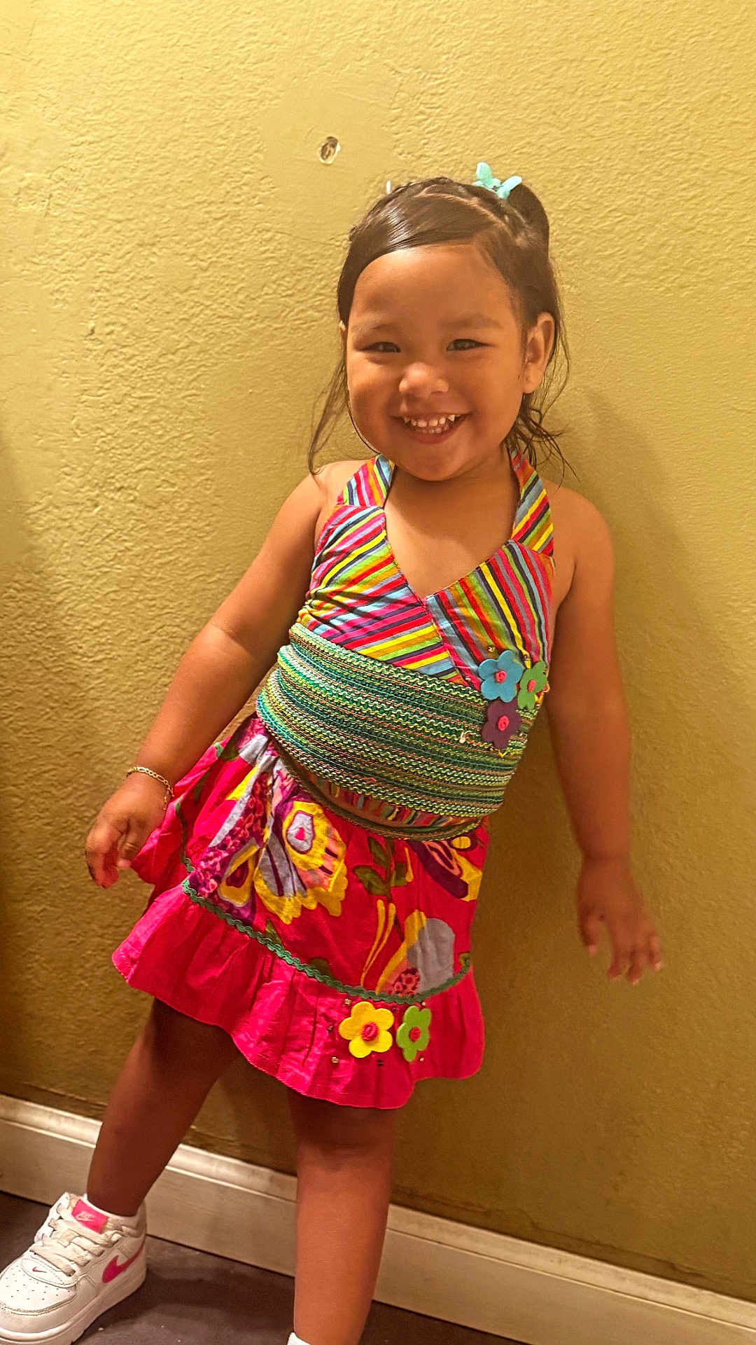 Keyianah Star joined the competition — help win amazing prizes! child, girl, smile, colorful_dress, striped, floral_pattern, sneakers, white_shoes, bracelet, hair_tie, posing, standing, indoor, yellow_wall, happy, cute, portrait, fashion, playful, young