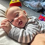 Sam joined the competition — help win amazing prizes! baby, child, smiling, striped_clothing, indoor, toy, happy, face, head, person, lying_down, cushion, carpet, colorful, play, infant, cheerful, closeup, cozy, cute