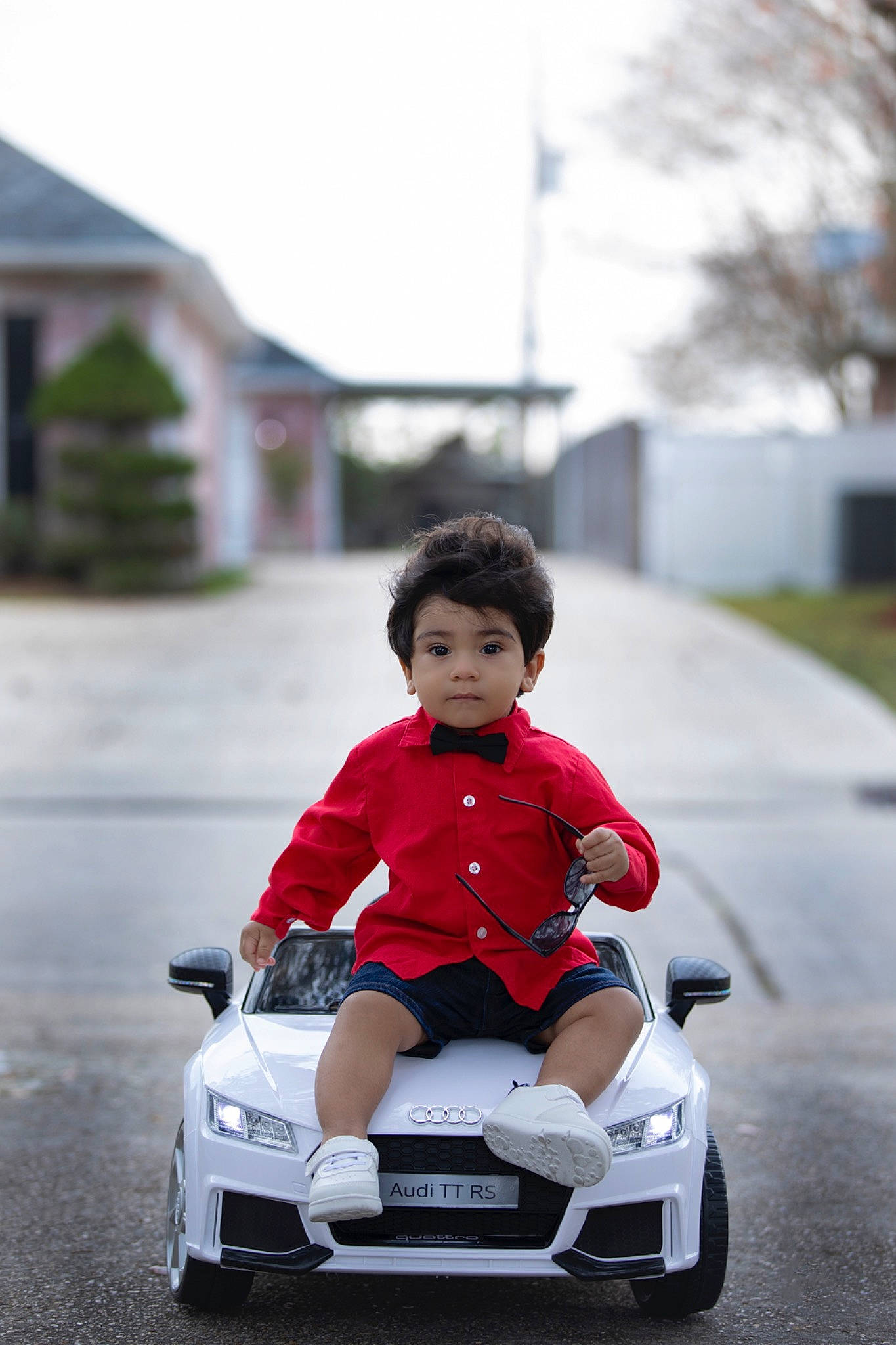 Bryan joined the competition — help win amazing prizes! automotive_design, automotive_exterior, automotive_lighting, automotive_tire, dress, eye, happy, head, helmet, jacket, motor_vehicle, person, plant, riding_toy, rolling, sunglasses, tire, toddler, toy, vehicle