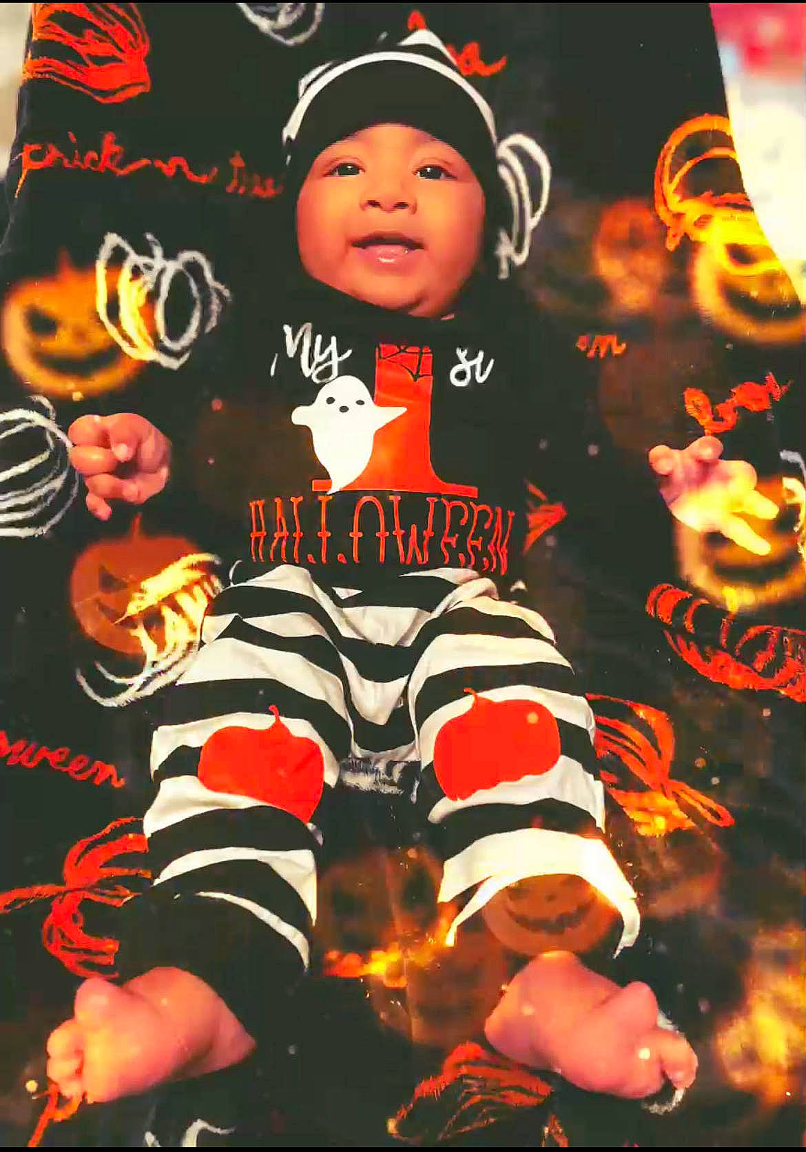 Oliver is registered to the contest to win money with this photo: baby, baby_toddler_clothing, baseball_cap, cap, child, font, happy, hat, headwear, jersey, orange, pattern, person, photo_caption, player, shorts, sleeve, smile, sportswear, t_shirt