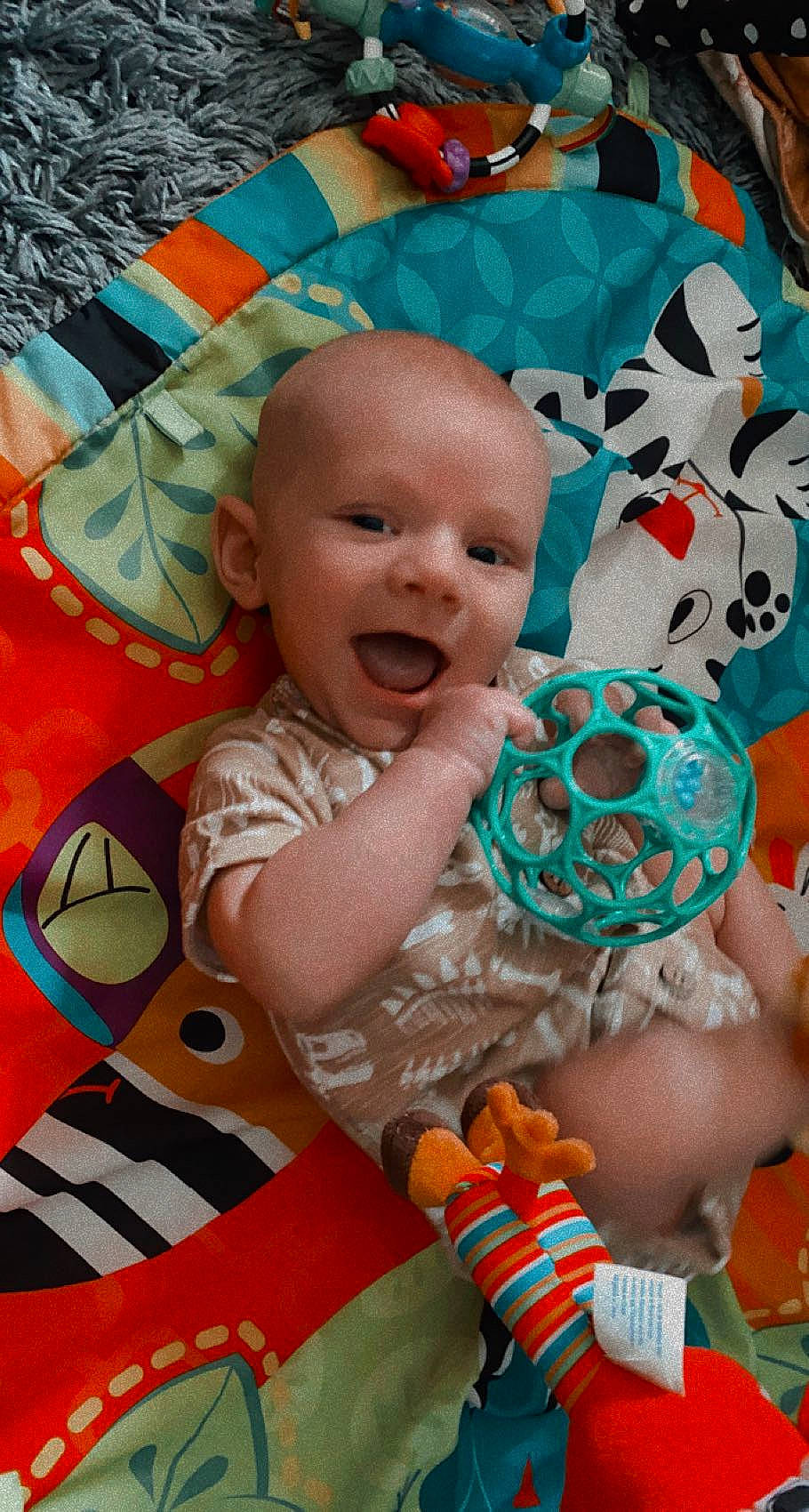 Jasper is registered to the contest to win money with this photo: baby, baby_products, baby_toddler_clothing, cheek, child, eye, facial_expression, fun, happy, head, iris, orange, people, person, pink, product, skin, smile, snapshot, textile