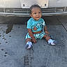 Kaida joined the competition — help win amazing prizes! baby, child, sitting, concrete, car_bumper, clothing, shorts, shirt, monsters, pacifier, toy, smiling, curious, outdoor, feet, socks, hair, face, expression, daylight