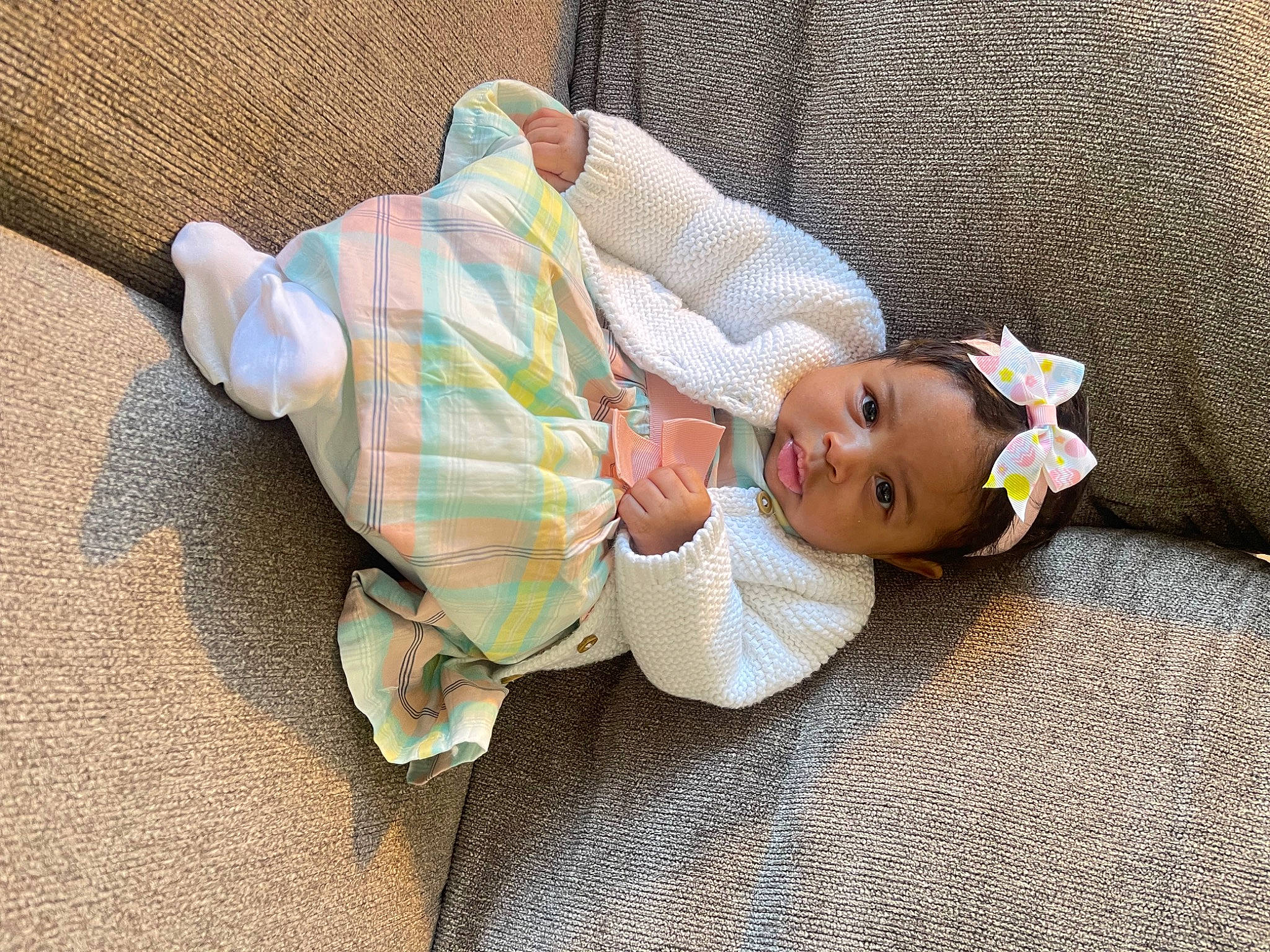 Joelle is registered to the contest to win money with this photo: baby, baby_products, baby_toddler_clothing, baby_toys, cheek, child, comfort, doll, face, foot, grass, head, human_body, linens, person, sitting, sock, textile, toddler, toy