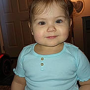 Ashley joined the competition — help win amazing prizes! buttoned_shirt, carpet, child, cute, door, face, fan, flash_lighting, hair, hand, indoor, lamp, light_blue_shirt, person, portrait, room, smile, standing, toddler, young_child