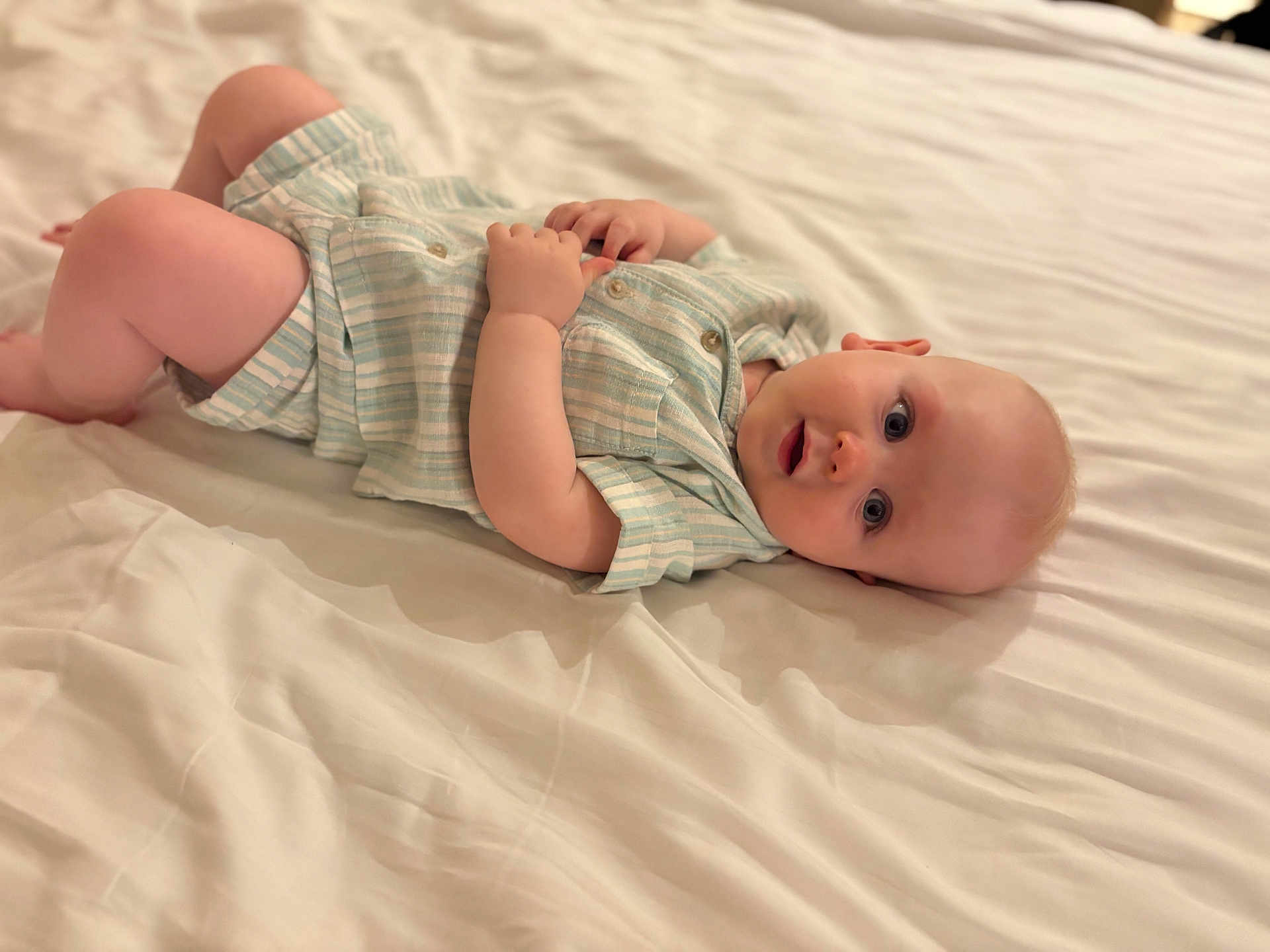 Archie joined the competition — help win amazing prizes! baby, infant, bed, bedding, clothing, cute, face, hand, laying_down, light, looking, one_person, person, portrait, skin, soft, striped, toddler, white, young_child