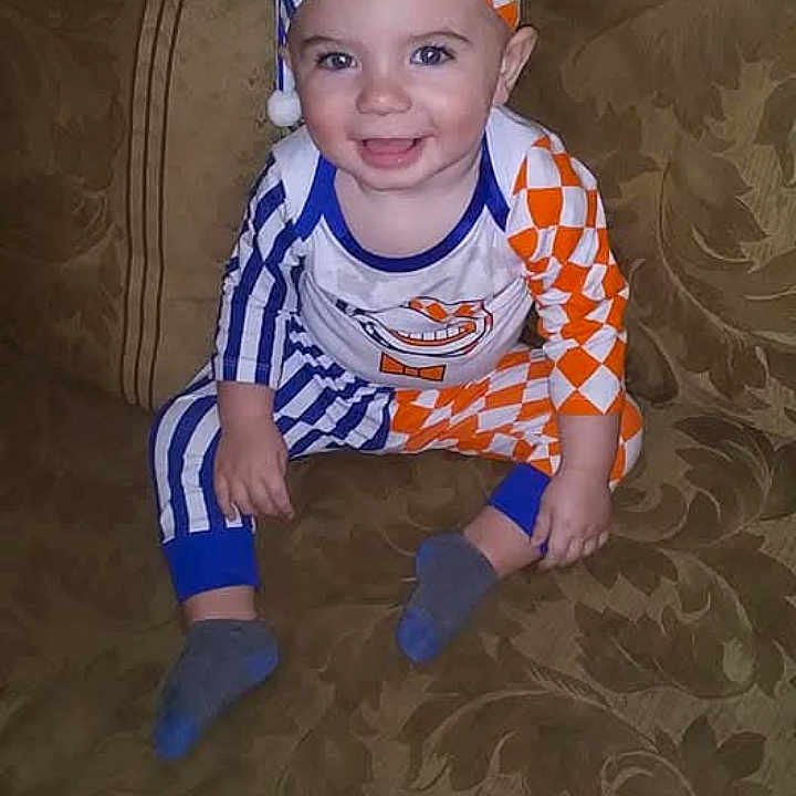 Bryison is registered to the contest to win money with this photo: baby, clothing, costume, couch, cushion, face, furniture, happy, hat, head, homedecor, hosiery, pants, people, person, photography, portrait, sitting, smile, sock