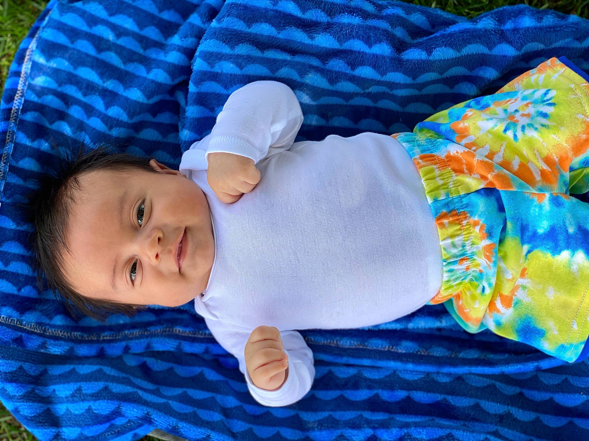 Abraham is registered to the contest to win money with this photo: azure, baby, baby_products, baby_toddler_clothing, blue, child, comfort, electric_blue, grass, hat, pattern, person, product, skin, sleeve, toddler