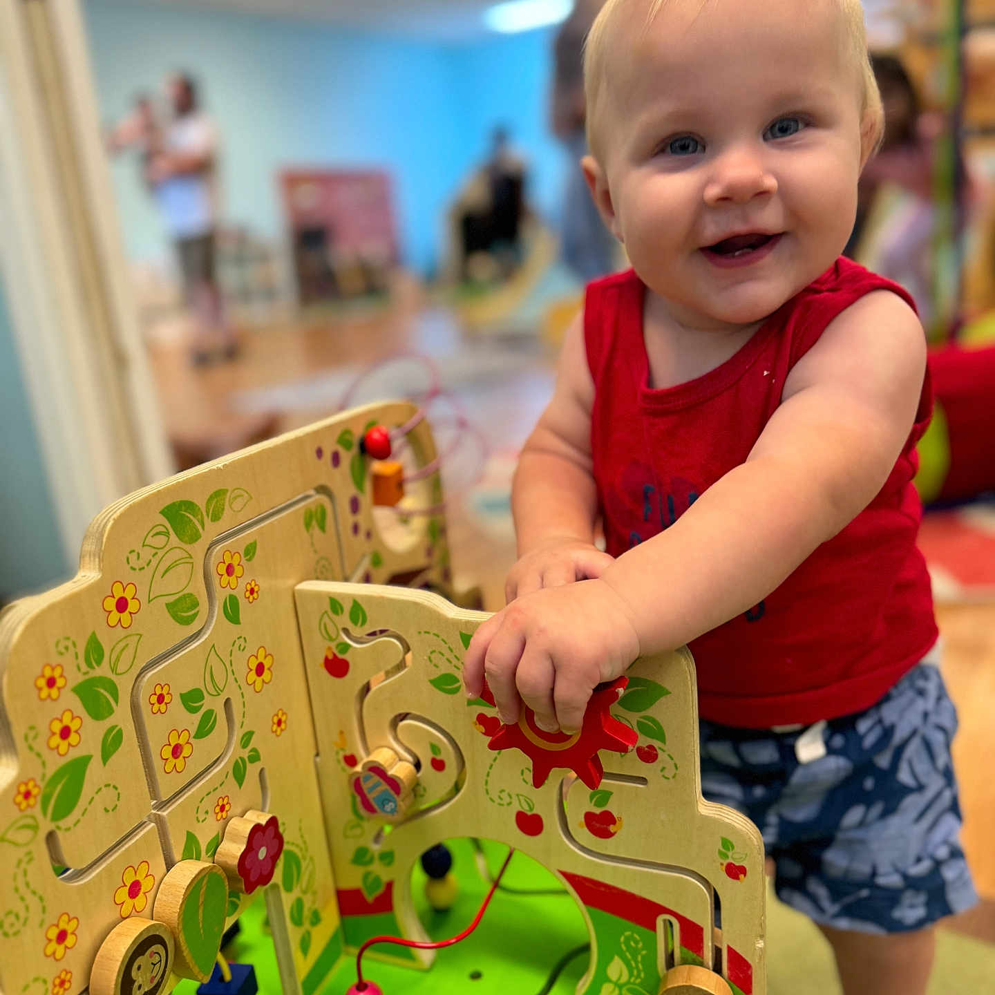 Waylen is registered to the contest to win money with this photo: baby, bodypart, clothing, face, finger, footwear, hand, head, indoors, kindergarten, outdoorplayarea, person, photography, play, playarea, portrait, shoe, shorts, tape, toy