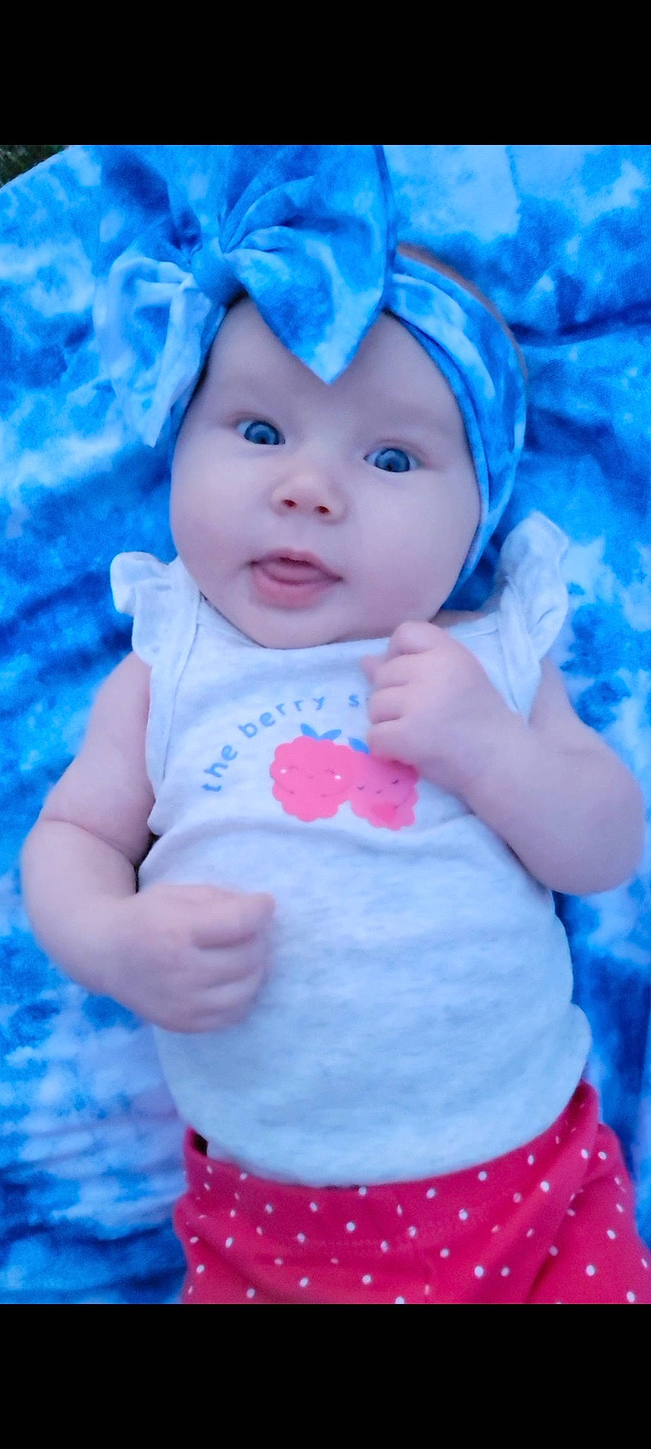 Clover is registered to the contest to win money with this photo: aqua, azure, baby, baby_toddler_clothing, blue, cap, child, cloud, facial_expression, gesture, happy, headgear, headwear, person, pink, product, purple, skin, sleeve, textile