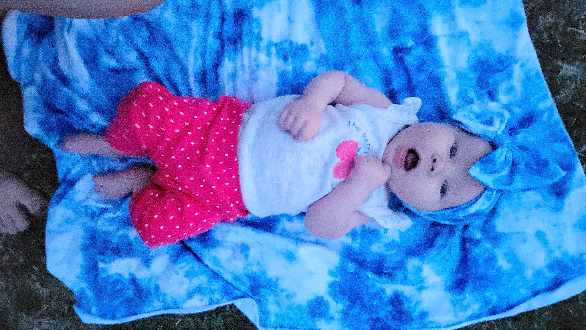 Clover is registered to the contest to win money with this photo: aqua, azure, baby, baby_toddler_clothing, beauty, blue, child, electric_blue, grass, hat, headwear, mammal, pattern, person, pink, plant, product, purple, sleeve, textile