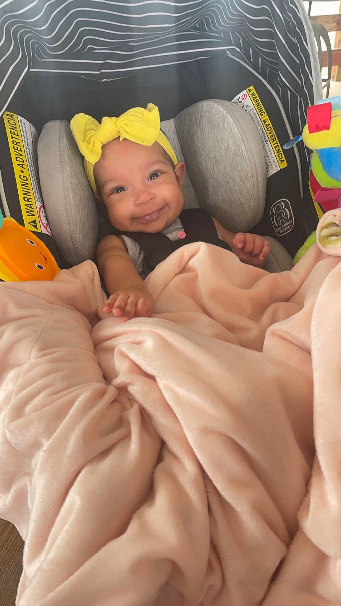 Kamora joined the competition — help win amazing prizes! abdomen, baby, baby_products, cap, car_seat, child, comfort, face, finger, fun, happy, headwear, joy, linens, orange, person, pink, room, smile, stuffed_toy