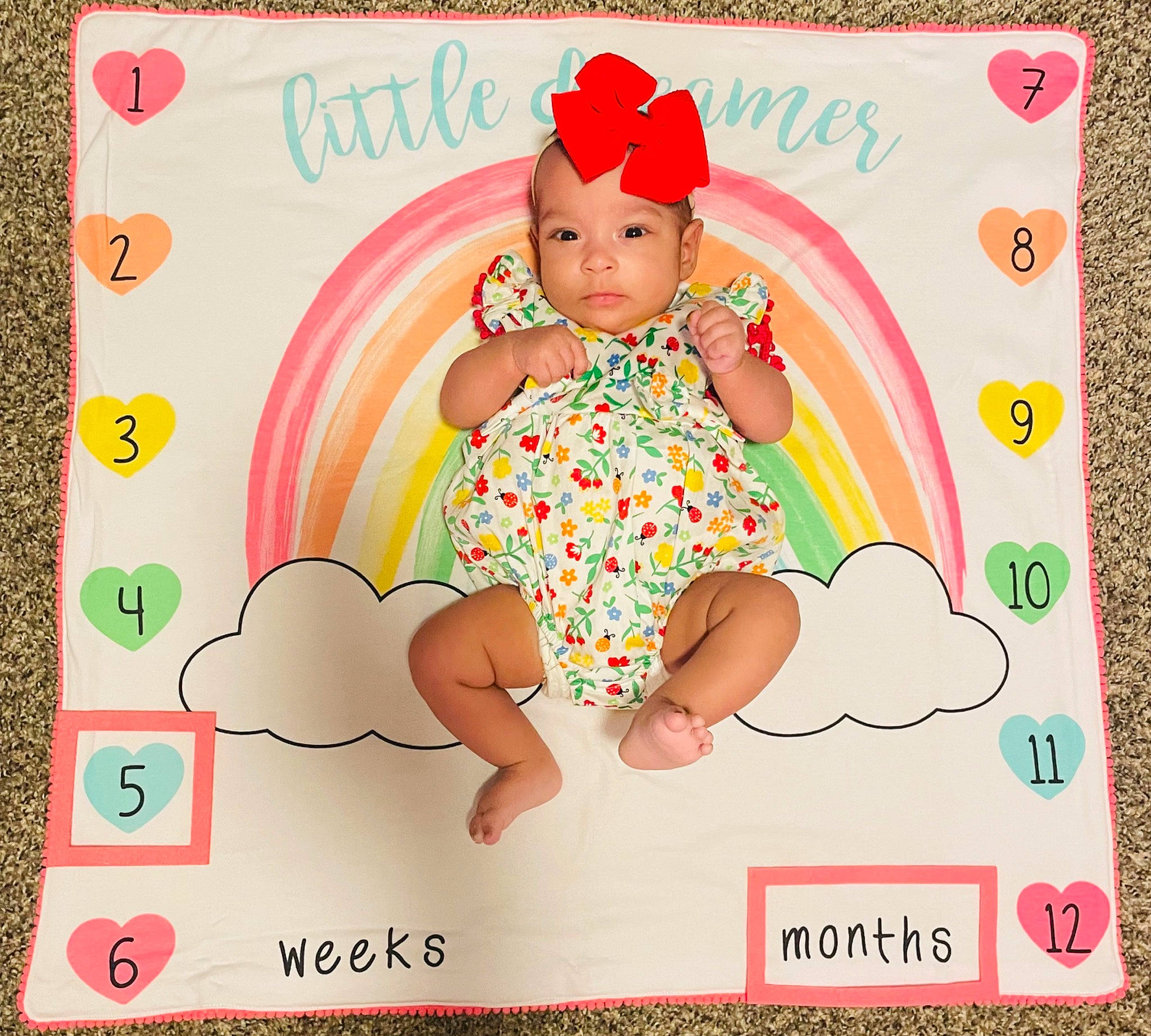 Kamora joined the competition — help win amazing prizes! baby, baby_toddler_clothing, cap, child, circle, font, greeting_card, happy, headwear, magenta, paper, paper_product, party_supply, pattern, peach, person, pink, product, rectangle, sleeve