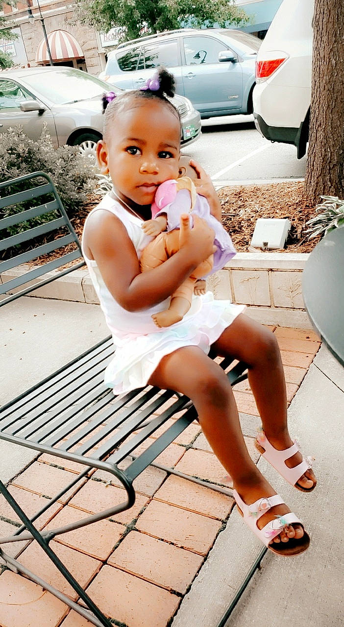 Ava joined the competition — help win amazing prizes! baby, beauty, car, child, child_model, footwear, human_leg, leg, person, photography, shoe, sitting, thigh, toddler, vacation, vehicle