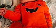 Khloie is registered to the contest to win money with this photo: applique, baby, bed, blanket, bodypart, couch, cushion, face, finger, furniture, hand, happy, head, homedecor, newborn, pattern, person, photography, portrait, smile