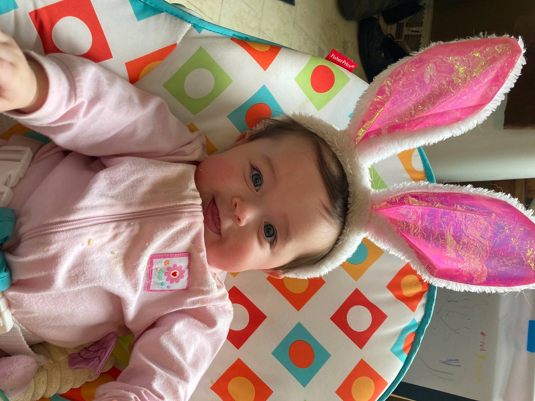 Shaelynn is registered to the contest to win money with this photo: baby, baby_products, baby_toddler_clothing, baby_toys, cheek, child, fashion_accessory, fun, happy, linens, magenta, pattern, person, pink, room, skin, smile, toddler