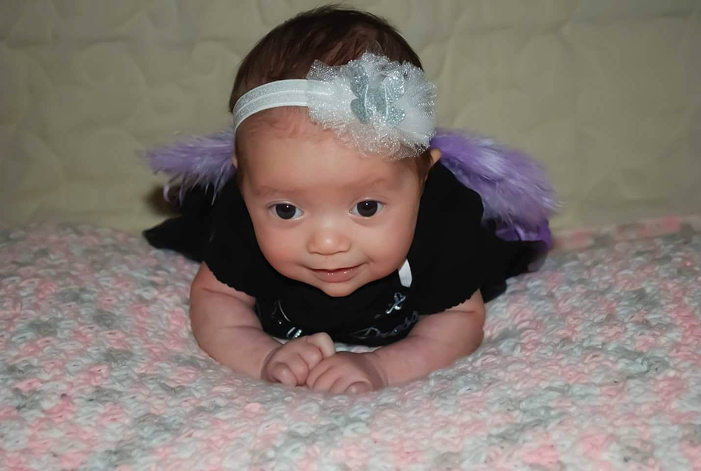 Rya is registered to the contest to win money with this photo: baby, baby_toddler_clothing, cap, chin, costume_hat, eye, eyebrow, flash_photography, flooring, happy, head, headband, headgear, headpiece, iris, jewellery, person, pink, sleeve, smile