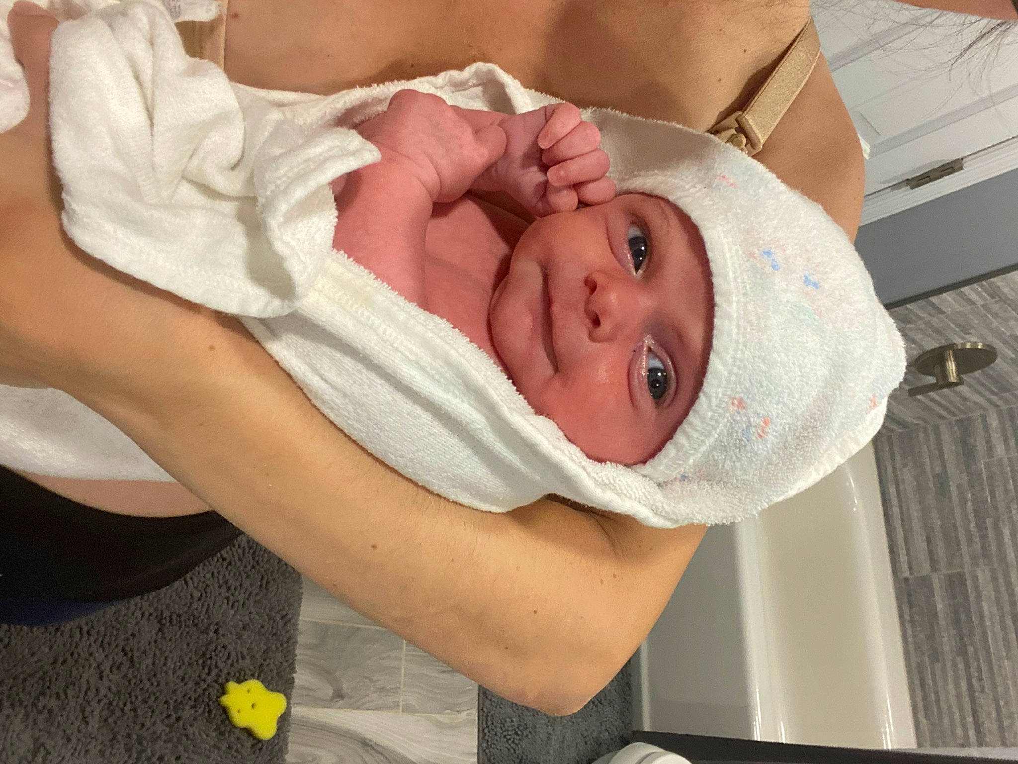 Sebastian is registered to the contest to win money with this photo: abdomen, baby, baby_products, baby_toddler_clothing, chest, child, childbirth, comfort, event, eyebrow, happy, hat, headgear, headwear, hospital, linens, mouth, person, room, sleep