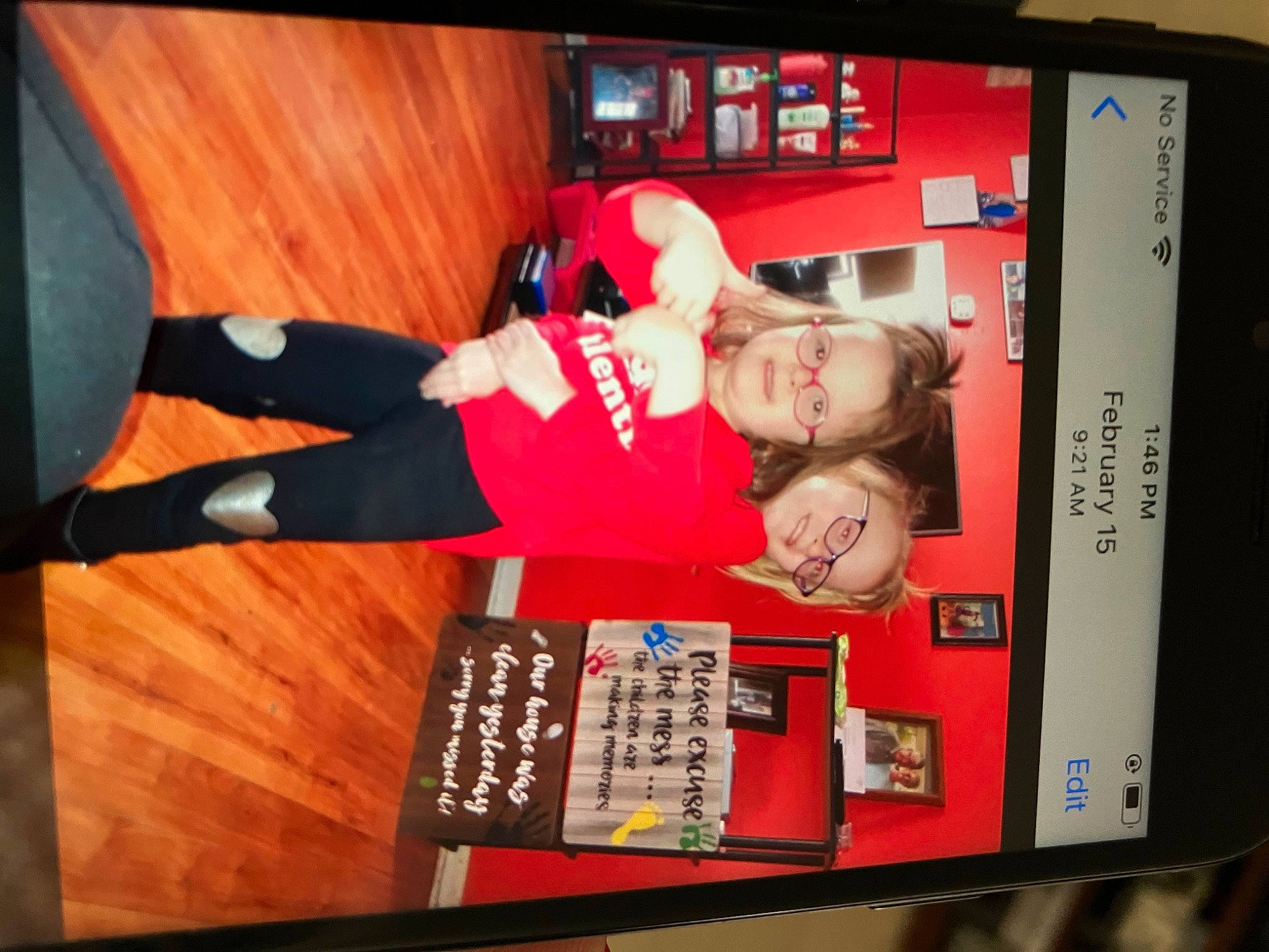 Krislynn is registered to the contest to win money with this photo: advertising, communication_device, display_device, flat_panel_display, font, gadget, hardwood, joy, media, mobile_device, multimedia, person, portable_communications_device, room, sleeve, sports_uniform, sportswear, telephony, television, television_program