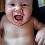 baby, child, smiling, happy, infant, car_seat, warning_label, diaper, skin, closeup, face, human, cute, joy, expression, baby_skin, cheerful, young, portrait, indoor