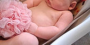 Randy joined the competition — help win amazing prizes! baby, sleeping, infant, baby_seat, pink, bath_sponge, skin, chubby, face, arm, leg, indoor, floor, tile_floor, furniture, peaceful, child, rest, relaxing, person