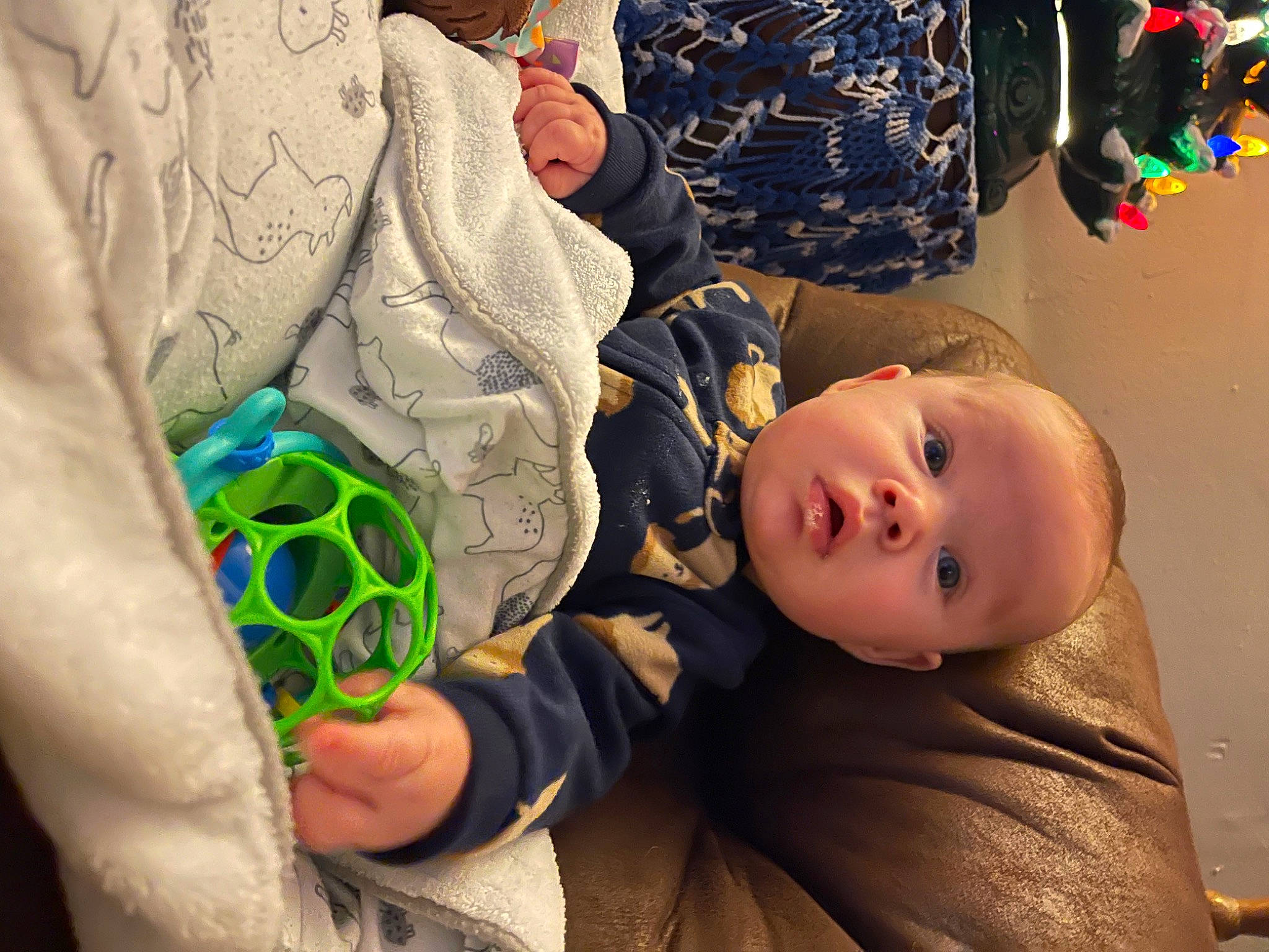 Kolt is registered to the contest to win money with this photo: baby, baby_products, baby_toddler_clothing, ball, child, comfort, football, fun, grass, headgear, pattern, person, personal_protective_equipment, photograph, play, room, soccer, soccer_ball, sports_toy, toddler