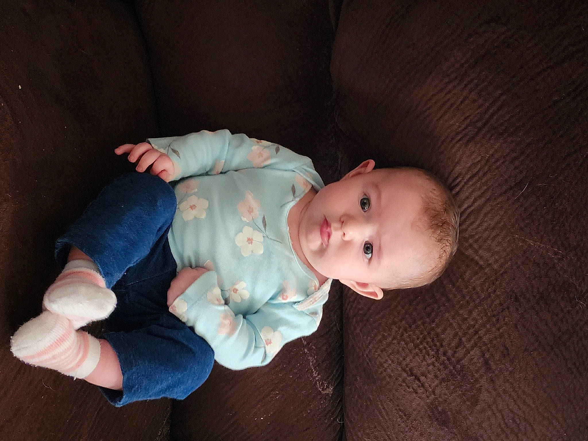 Summer is registered to the contest to win money with this photo: baby, baby_products, baby_toddler_clothing, cheek, child, comfort, iris, nose, pattern, person, sitting, skin, sleeve, toddler, wood