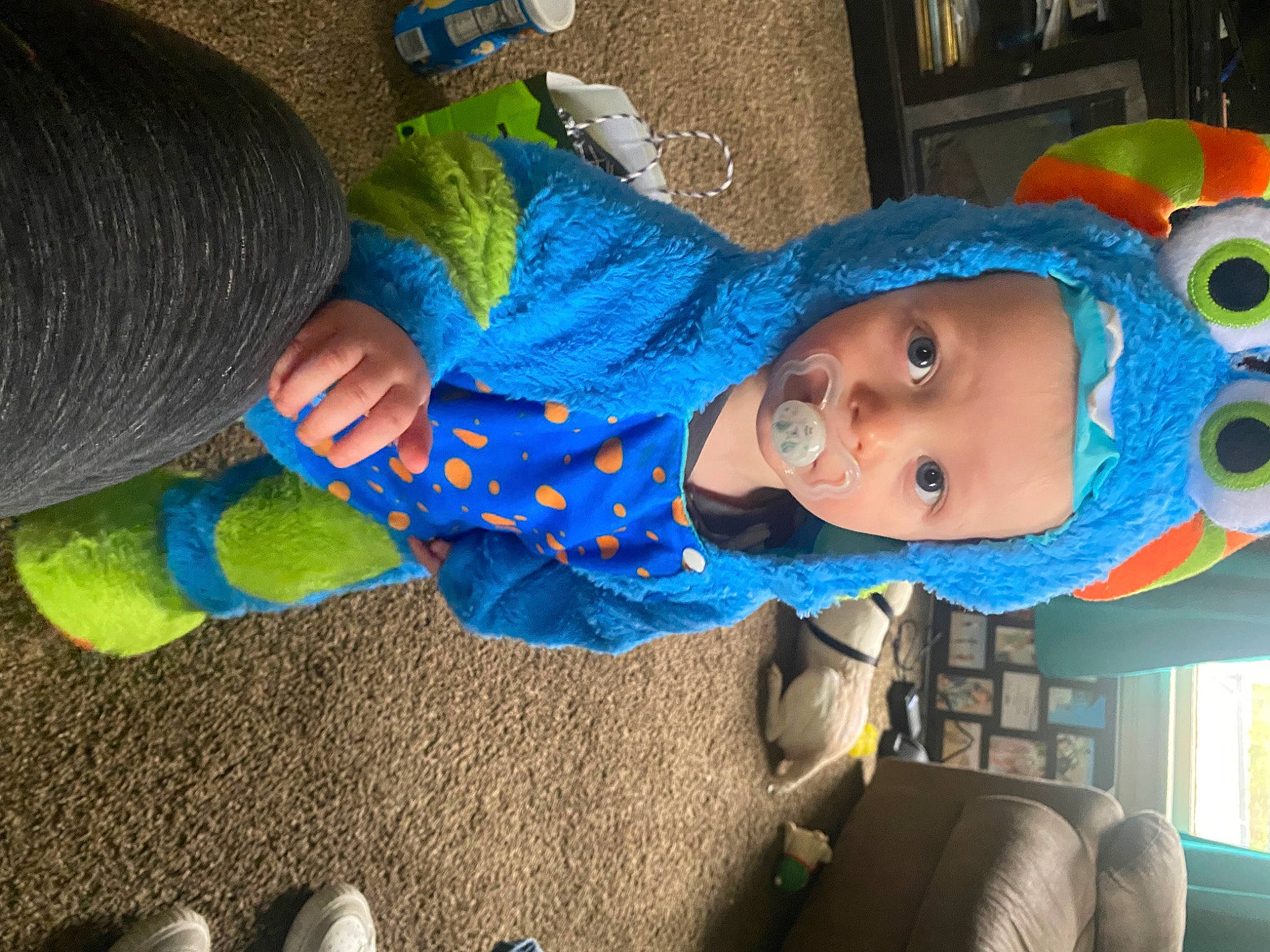 Jameson joined the competition — help win amazing prizes! azure, baby, baby_products, baby_toddler_clothing, blue, child, costume, electric_blue, foot, fun, green, person, product, room, sitting, thread, toddler, wool, woolen