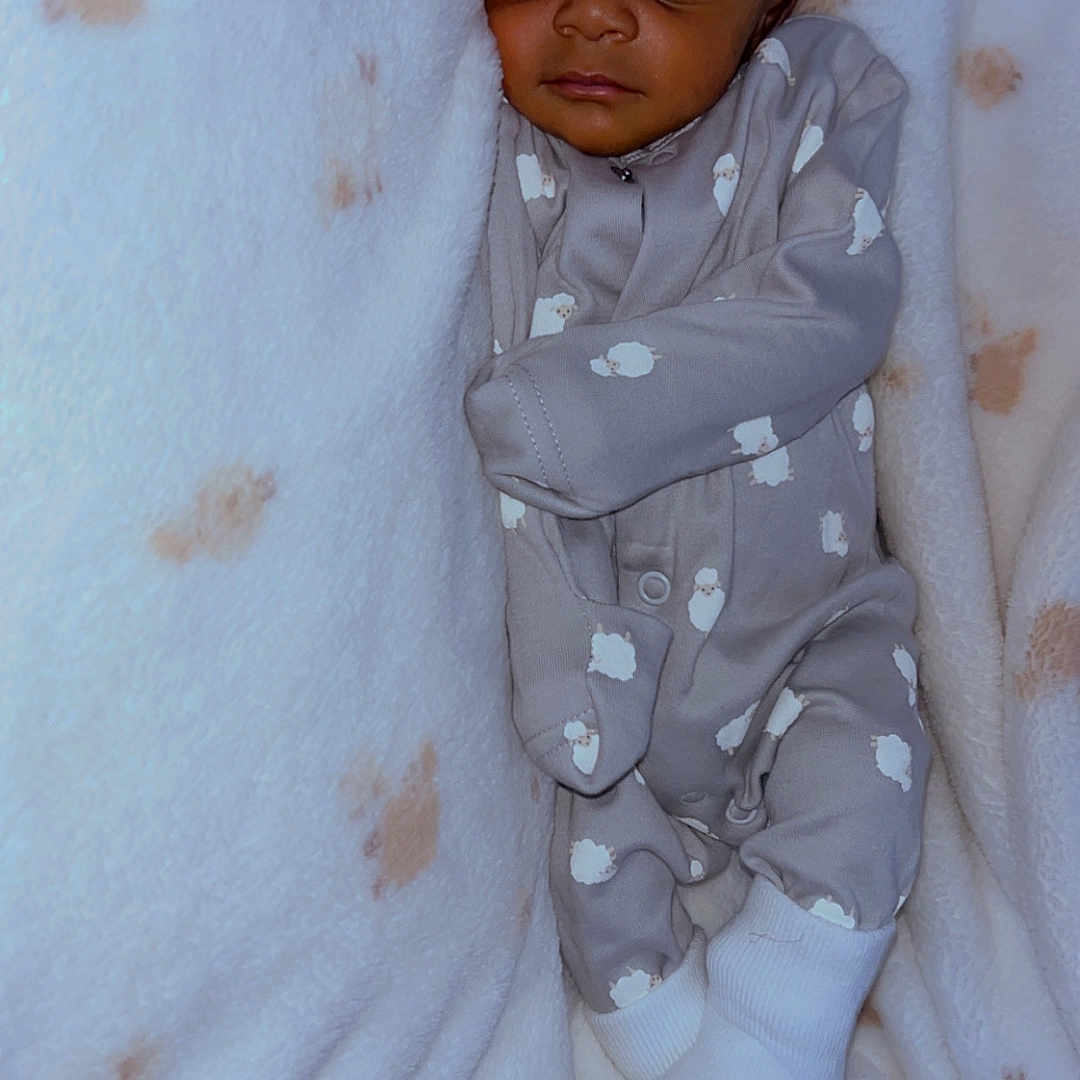 Ayyan joined the competition — help win amazing prizes! baby, baby_clothes, blanket, child, closeup, cozy, cute, indoors, infant, newborn, onesie, peaceful, portrait, resting, sheep_pattern, sleeping, snug, soft_texture, warm, white_socks