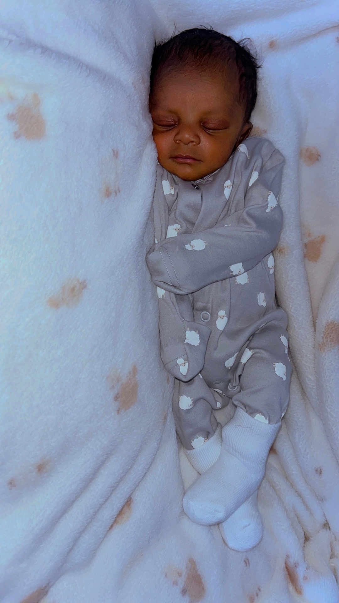 Ayyan joined the competition — help win amazing prizes! newborn, baby, sleeping, onesie, sheep_pattern, blanket, cozy, infant, soft_texture, white_socks, peaceful, child, portrait, cute, resting, indoors, closeup, warm, snug, baby_clothes