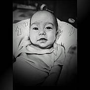 Archer joined the competition — help win amazing prizes! baby, infant, black_and_white, smile, face, blanket, clothing, portrait, cute, child, young, indoors, person, head, expression, sitting, cozy, soft, comfortable, monochrome