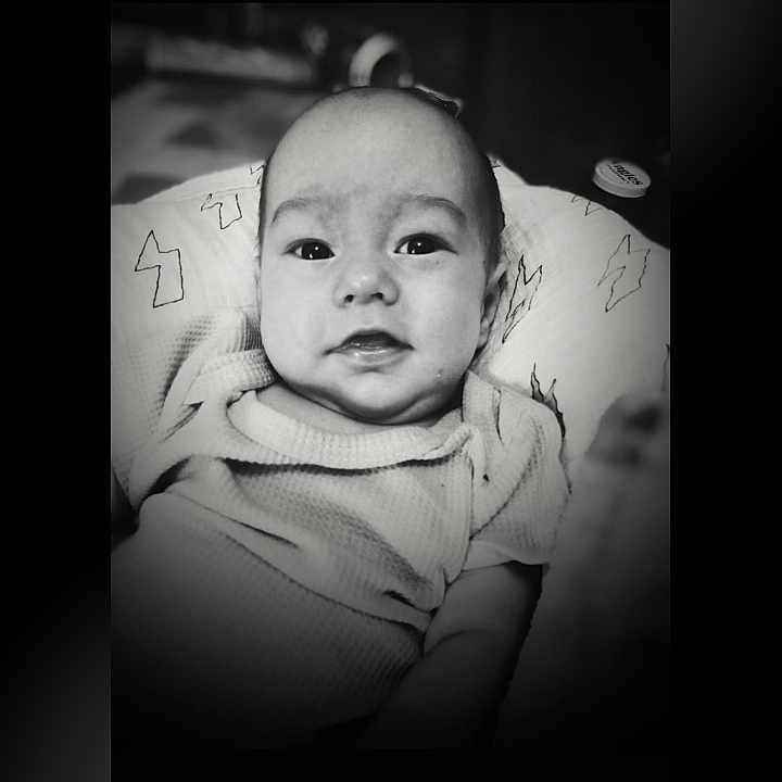 Archer joined the competition — help win amazing prizes! baby, black_and_white, blanket, child, clothing, comfortable, cozy, cute, expression, face, head, indoors, infant, monochrome, person, portrait, sitting, smile, soft, young