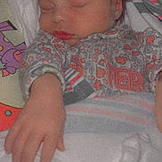 Wrenley is registered to the contest to win money with this photo: baby, sleeping, newborn, blanket, onesie, hand, face, child, infant, cozy, cute, soft, pattern, floral, resting, indoors, closeup, portrait, peaceful, young