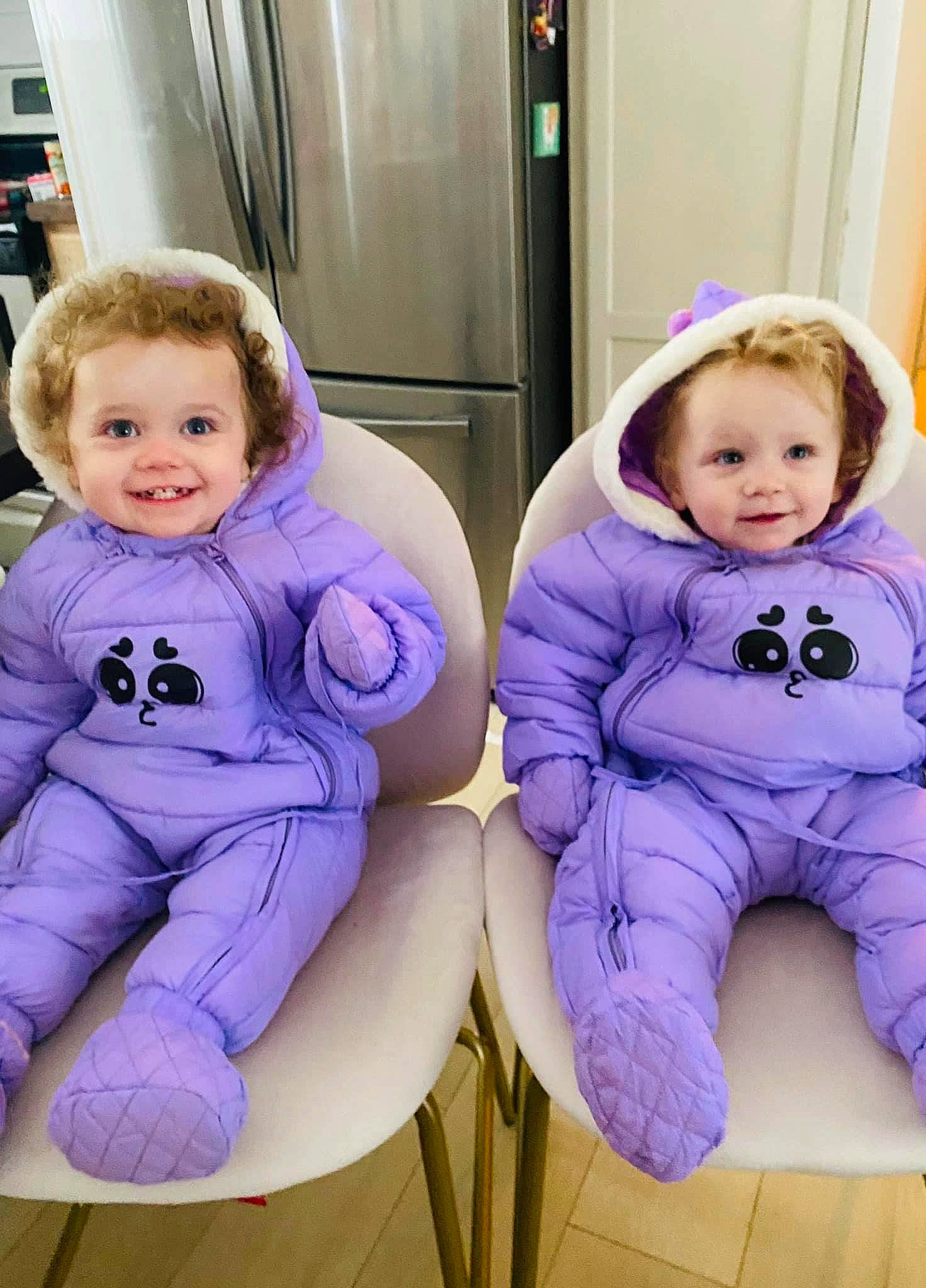 Elouise is registered to the contest to win money with this photo: arm, baby_toddler_clothing, cheek, child, electric_blue, face, gesture, happy, head, human_body, joy, leg, person, pink, plant, purple, sitting, sleeve, smile, toddler