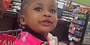 Dalylah joined the competition — help win amazing prizes! baseball, baseballbat, bodypart, candy, child, face, female, finger, food, girl, grocerystore, head, indoors, market, person, shop, shopping, sport, supermarket, sweets