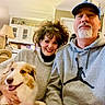 Leia joined the competition — help win amazing prizes! dog, couple, man, woman, selfie, portrait, smiling, happy, indoor, living_room, home, sofa, chair, lamp, cabinet, hoodie, cap, beard, pet, family
