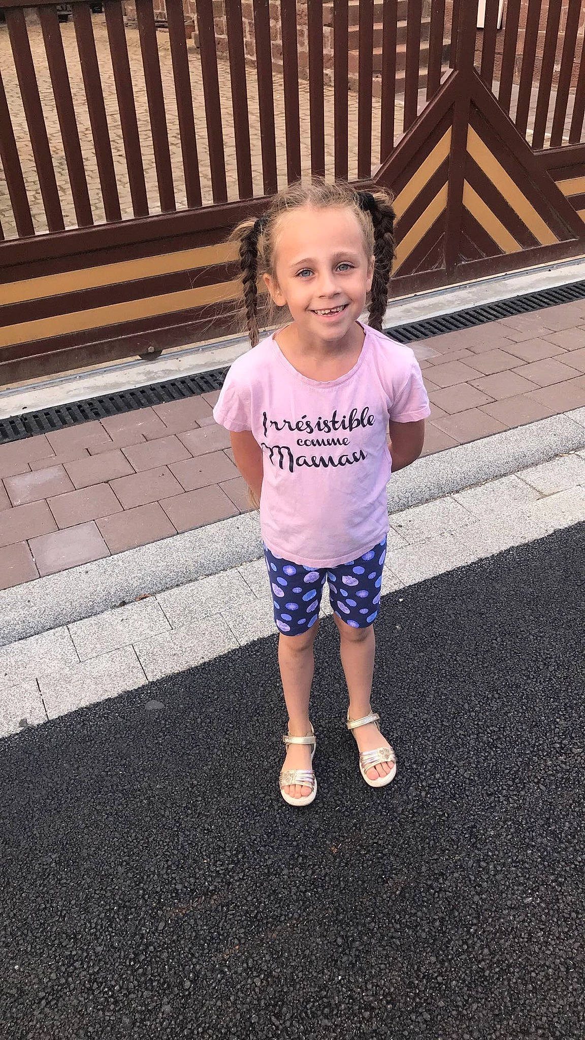 Kaylina participe au concours pour gagner de l'argent avec cette photo : asphalt, baby_toddler_clothing, child, clothing, electric_blue, fun, happy, human_body, human_leg, joy, leisure, person, recreation, road_surface, sandal, shorts, sleeve, smile, t_shirt, toddler