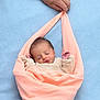 baby, blanket, blue_background, child, cozy, cute, gentle, hand, human, infant, newborn, peaceful, peach_cloth, portrait, resting, sleeping, small, soft_texture, swaddled, wrapped