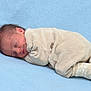 Jade participe au concours pour gagner de l'argent avec cette photo : baby, beige, blanket, blue, child, cozy, cute, face, footwear, indoors, infant, lying_down, newborn, peaceful, portrait, rest, sleeping, smile, socks, soft